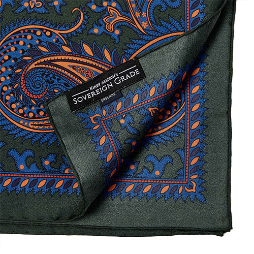 The Sovereign Grade 100% Silk Large Paisley Forest Pocket Square from KirbyAllison.com is crafted from luxurious silk and features a striking large paisley pattern in rich forest green, making it a sophisticated addition to any outfit.