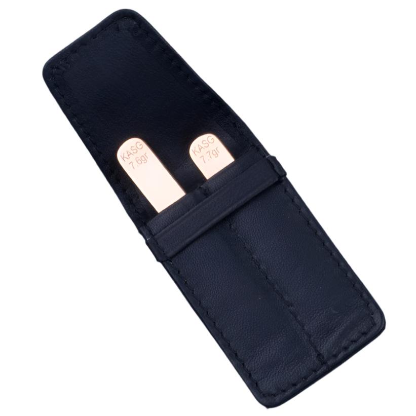 A black leather case with two Sovereign Grade Solid Gold Collar Stays (14k) from KirbyAllison.com in it.