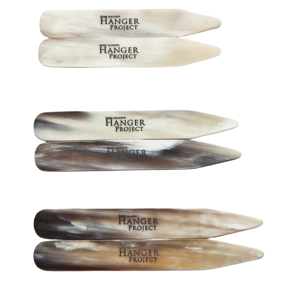 A set of Kirby Allison Horn Collar Stays on a white surface from KirbyAllison.com.