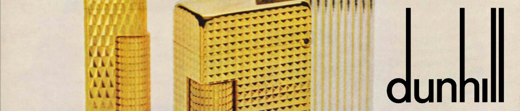 Close-up of three gold textured lighters with the word "dunhill" in black text on the right side.