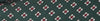 Close-up of a dark green fabric with a repeated pattern of red and white geometric shapes.