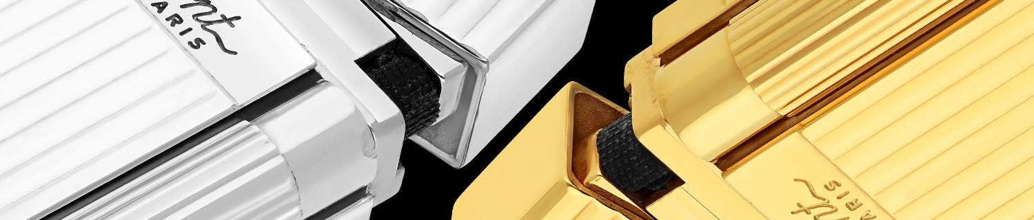 Close-up of the "S.T. Dupont Paris" logo on a blurred background.