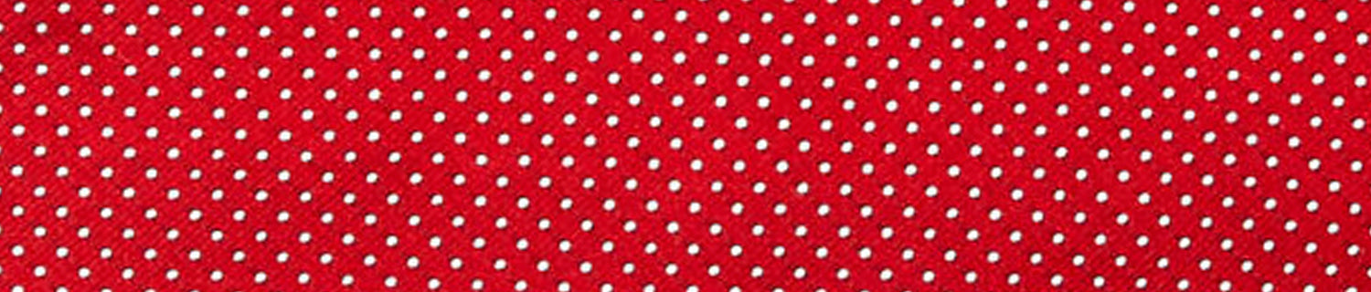 A pair of shoes and a brush on a table.