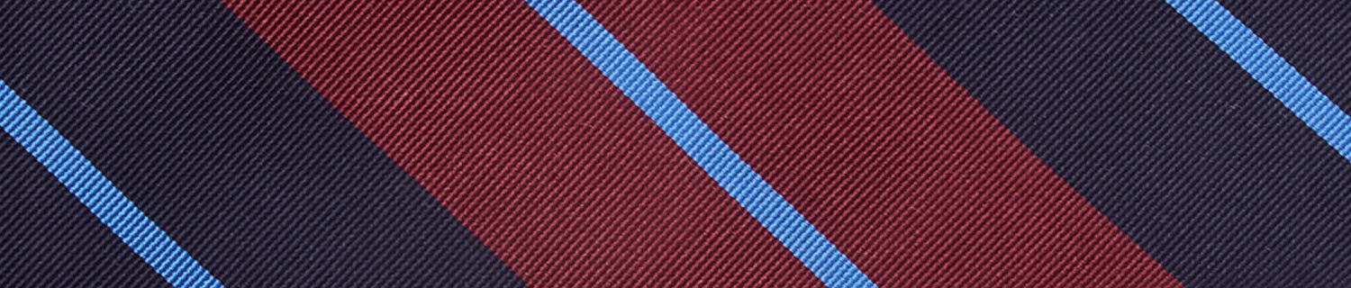 A man wearing a tie with a label on it.