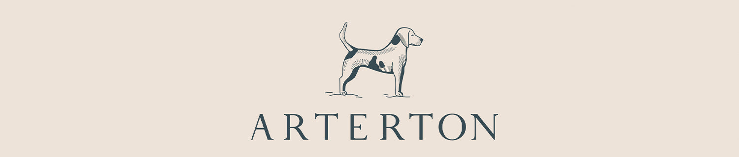 Illustration of a standing dog above the text "ARTERTON" on a light beige background.