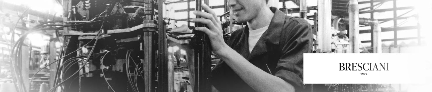 Person working on industrial machinery; Bresciani logo in the foreground.
