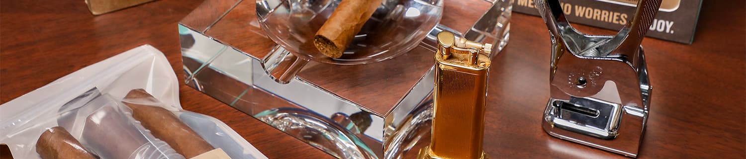 Cigars and cigar accessories on a table.