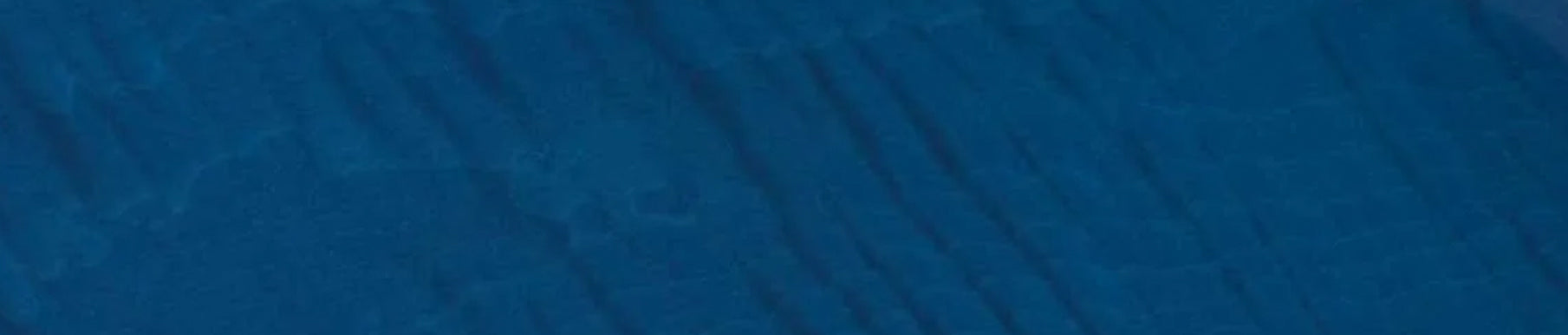 Red textured fabric surface with visible vertical and horizontal lines.