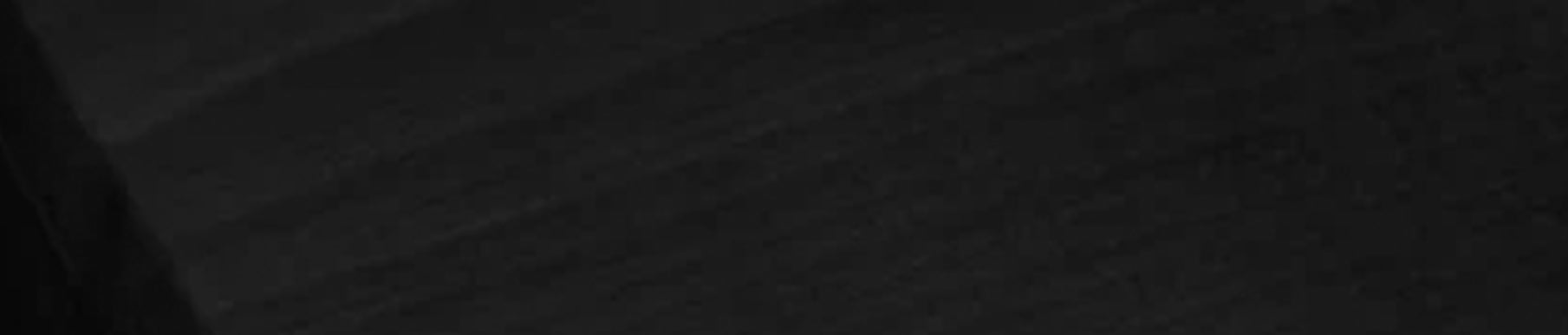 Red textured fabric surface with visible vertical and horizontal lines.