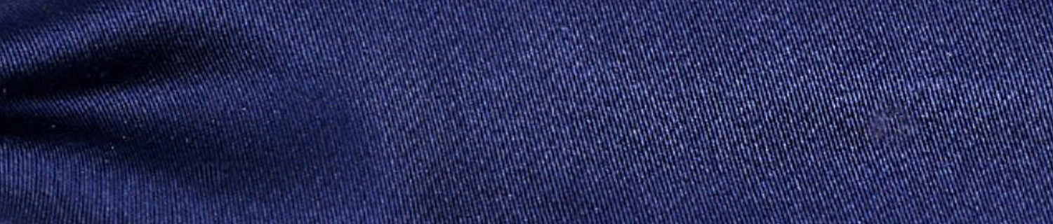 Close-up of blue textured fabric with a subtle sheen.