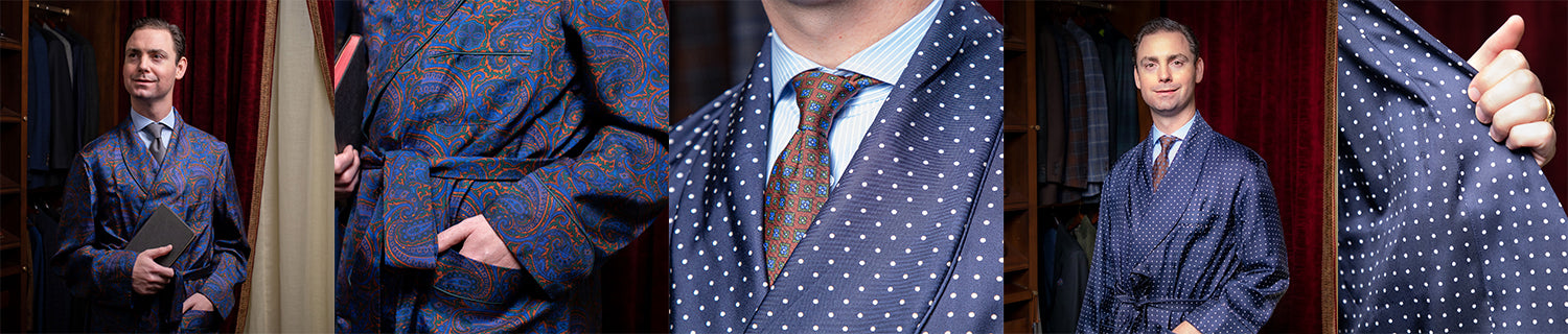 A man in a blue paisley suit standing in front of a closet.