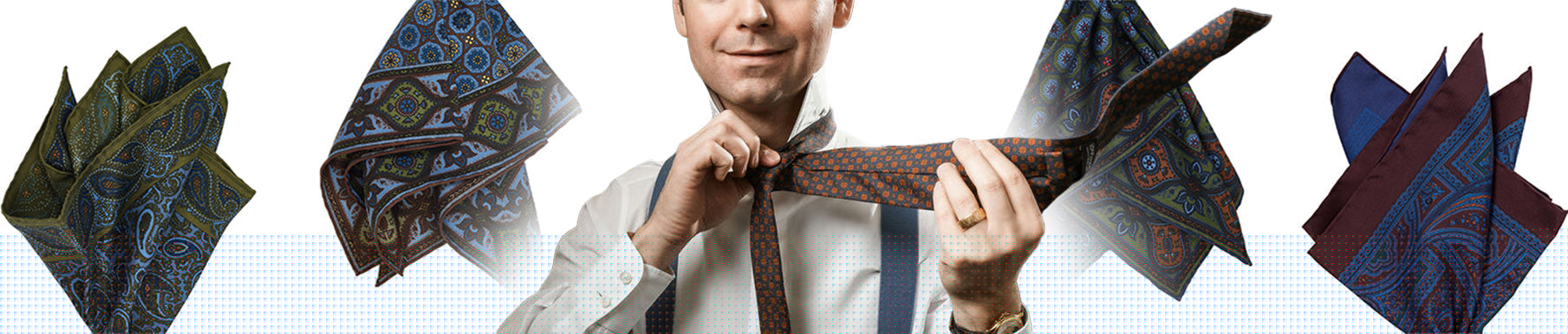 A man in a dress shirt ties a necktie, surrounded by four patterned pocket squares in green, blue, burgundy, and brown on a white background.