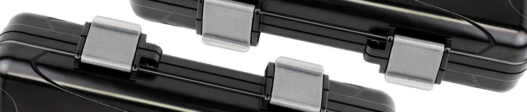 Close-up view of two black cases with metallic latches, shown against a white background.