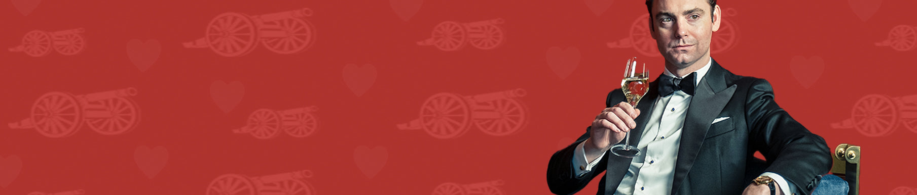 Red background with a repeating pattern of cannon and heart icons.