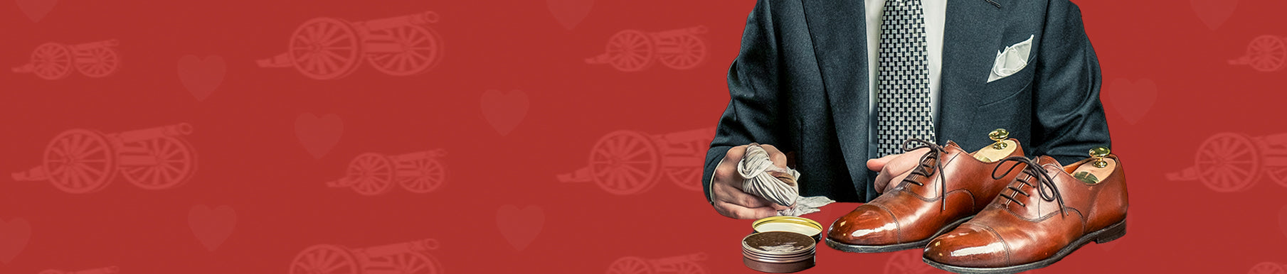 Red background with a pattern of cannons and hearts.