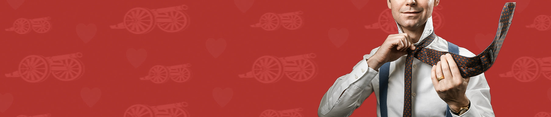 Red background with a pattern of cannons and hearts in a slightly darker shade.