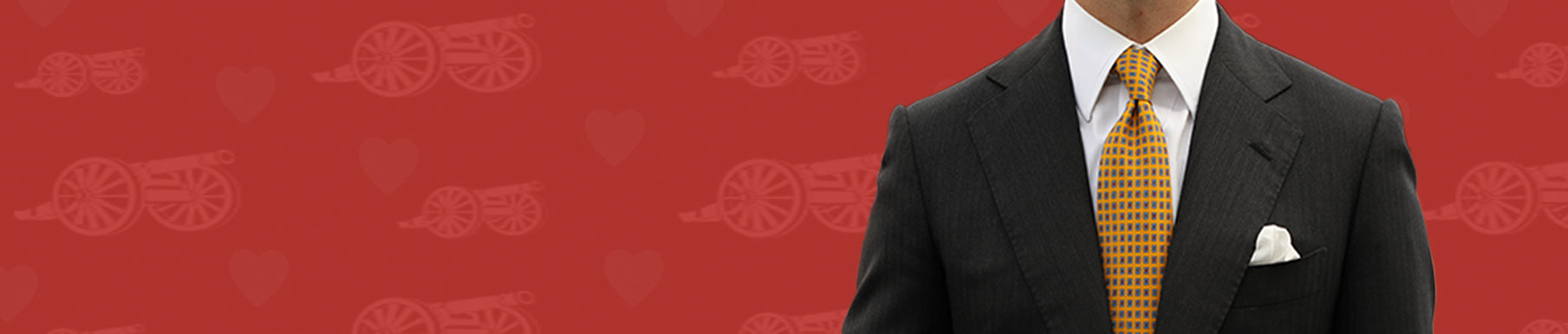 Red background with a pattern of cannons and hearts.