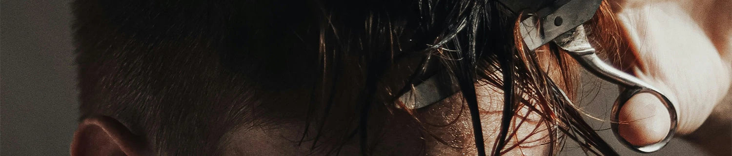 A man shaving his face.