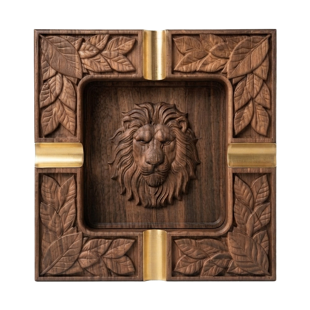 A square carved wooden ashtray featuring a detailed lion head in the center and leaf motifs around the border, accented with gold-toned metal dividers