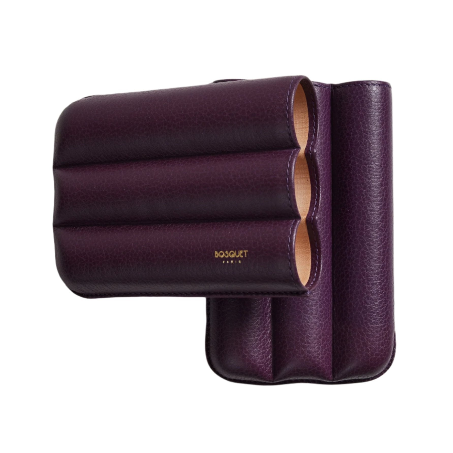 A Bosque Bosquet Smooth Purple Cylindrical Leather Cigar Case displayed on a white wall.