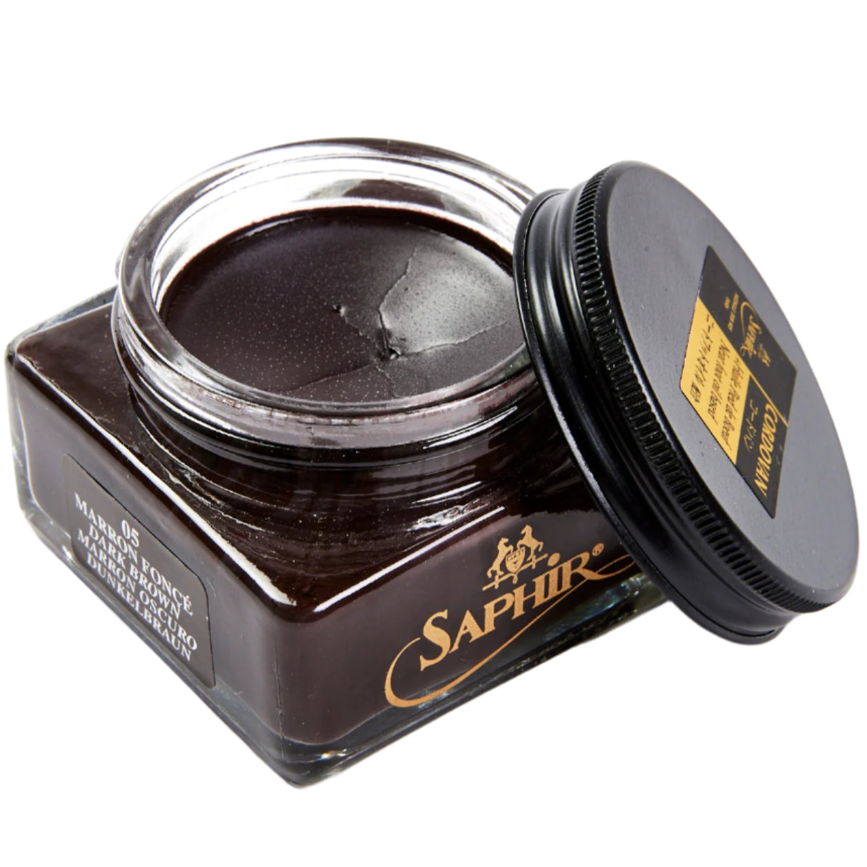 A jar of Saphir Cordovan Cream Shoe Polish by KirbyAllison.com on a white surface.