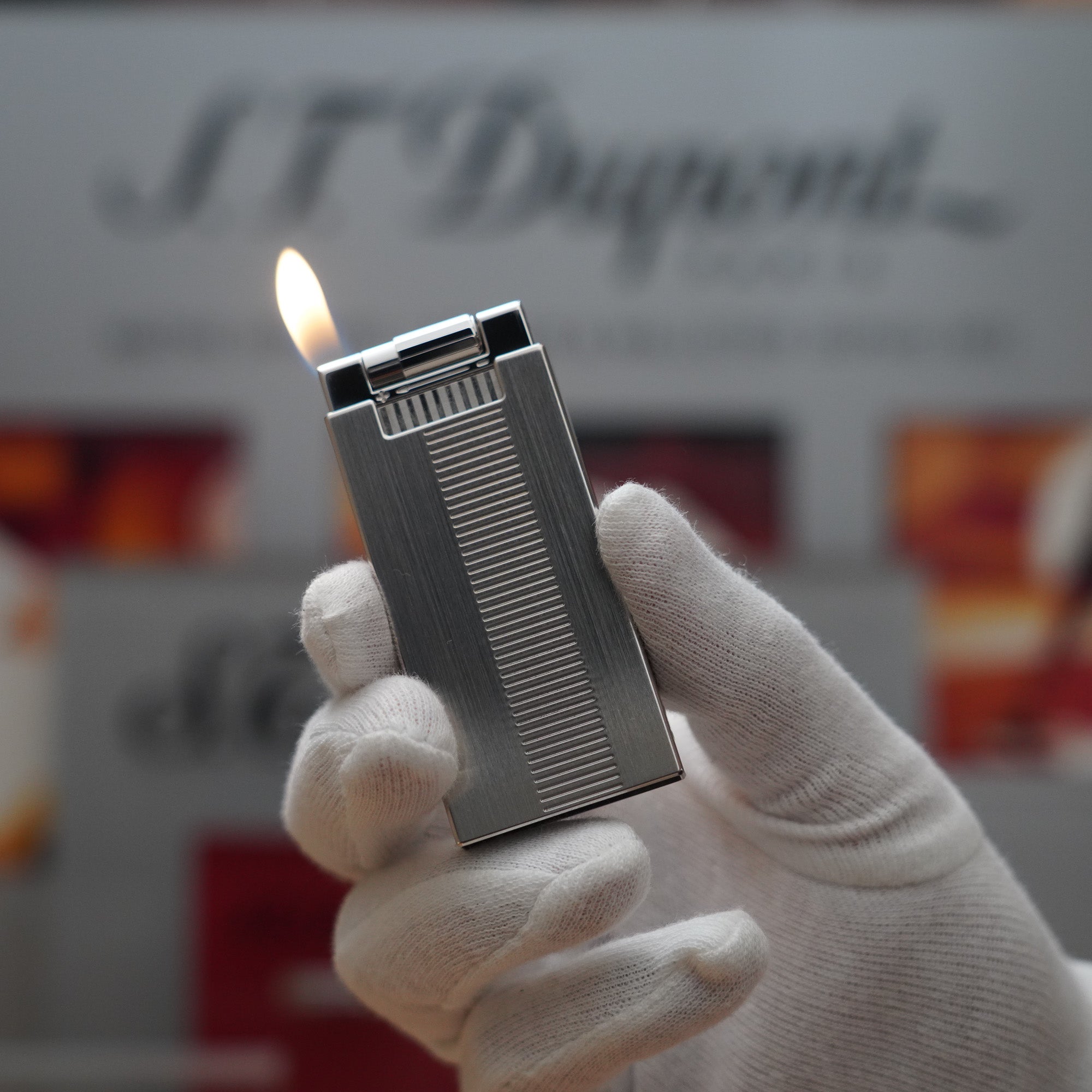 A Vintage 2000 S.T. Dupont Palladium Décor High Tech 2000s Lighter with the word st dymond on it.