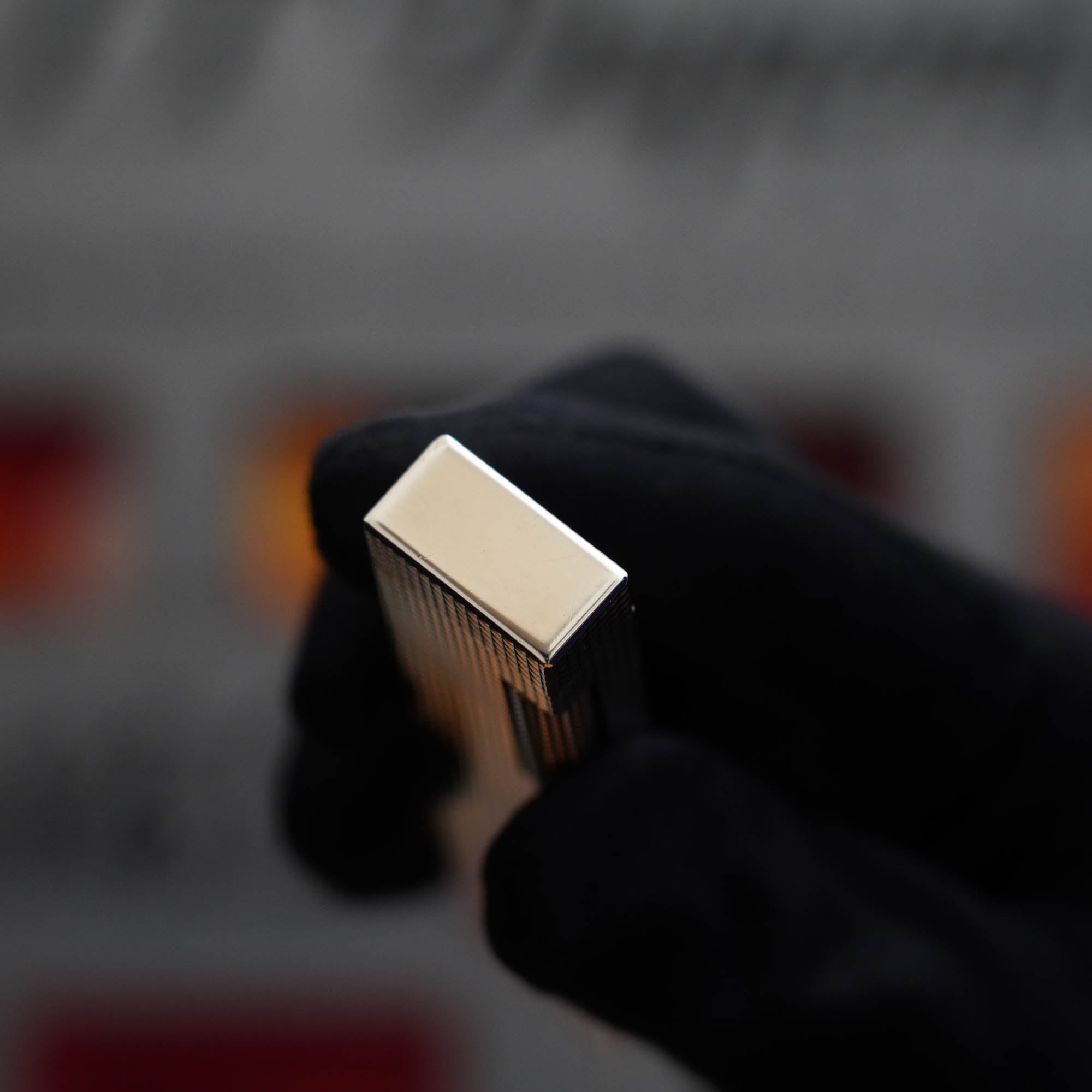 A person is holding up a Vintage 1970 Dunhill Table lighter.