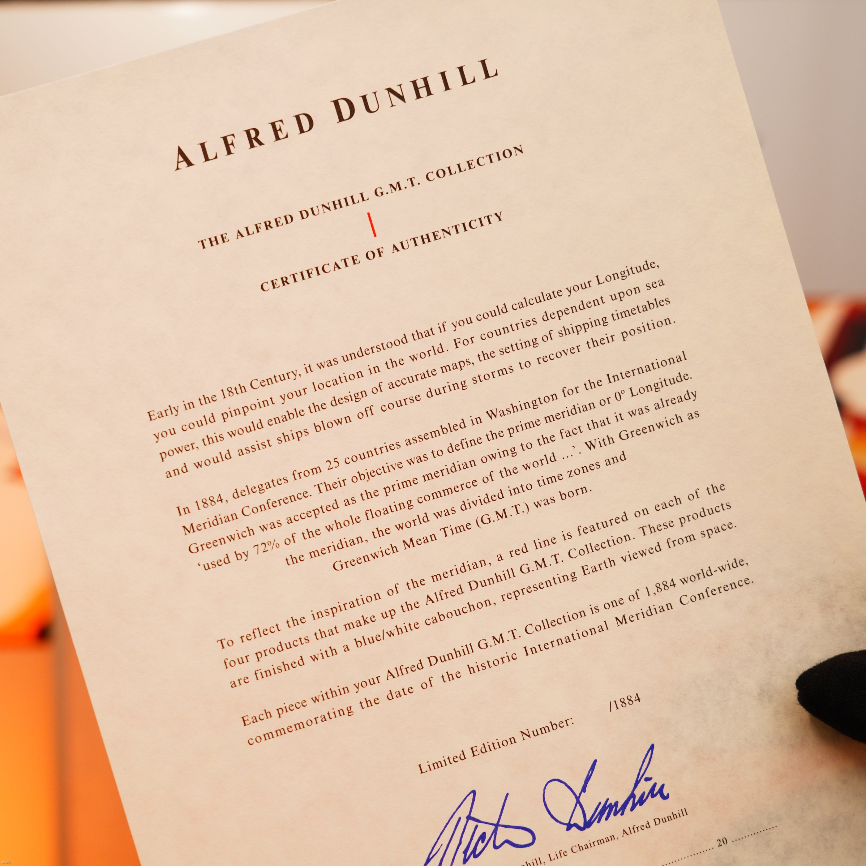 A certificate of authenticity for the Vintage Extremely Rare Alfred Dunhill Full Set GMT Full Solid Stainless Steel by Lucy Lighter, highlighting its luxury heritage and blue signature with a quality guarantee.