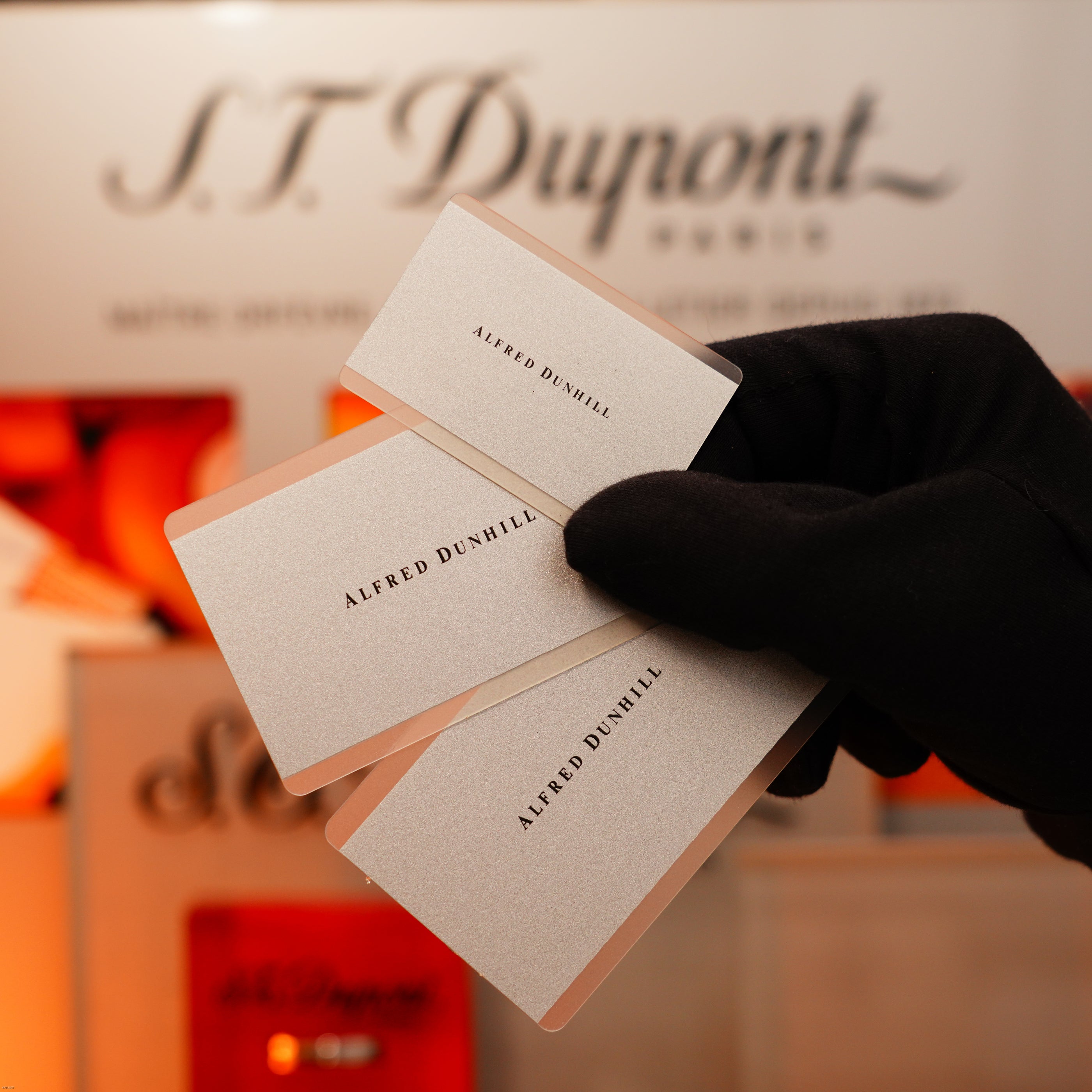 A gloved hand presents the Vintage Extremely Rare Alfred Dunhill Full Set GMT in solid stainless steel by Lucy Lighter, with signature details and full set—reflecting vintage luxury and exceptional craftsmanship.