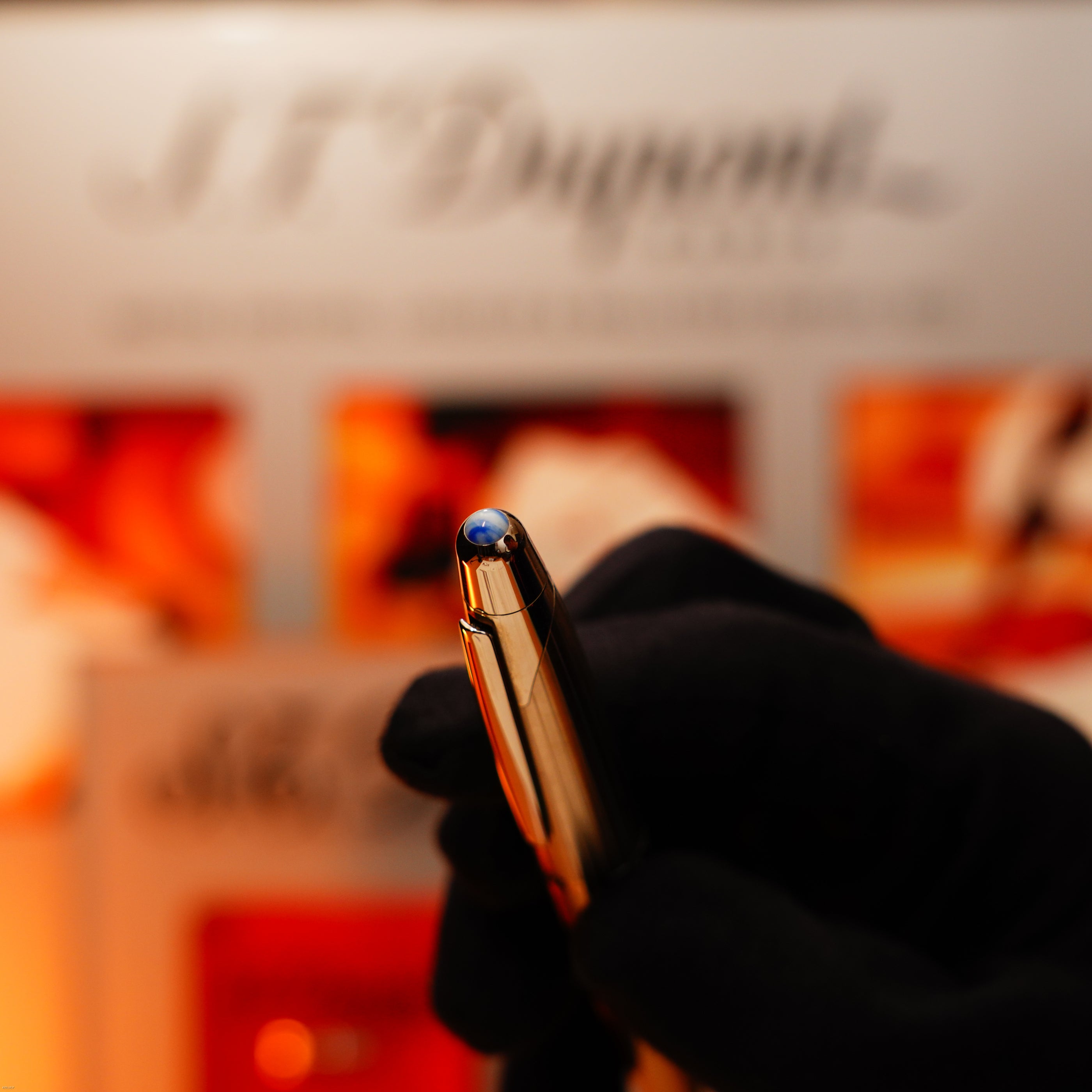 A gloved hand holds the Vintage Extremely Rare Alfred Dunhill Full Set GMT Full Solid Stainless Steel, an exclusive Lucy Lighter piece—timeless style meets quality guarantee and luxury craftsmanship.