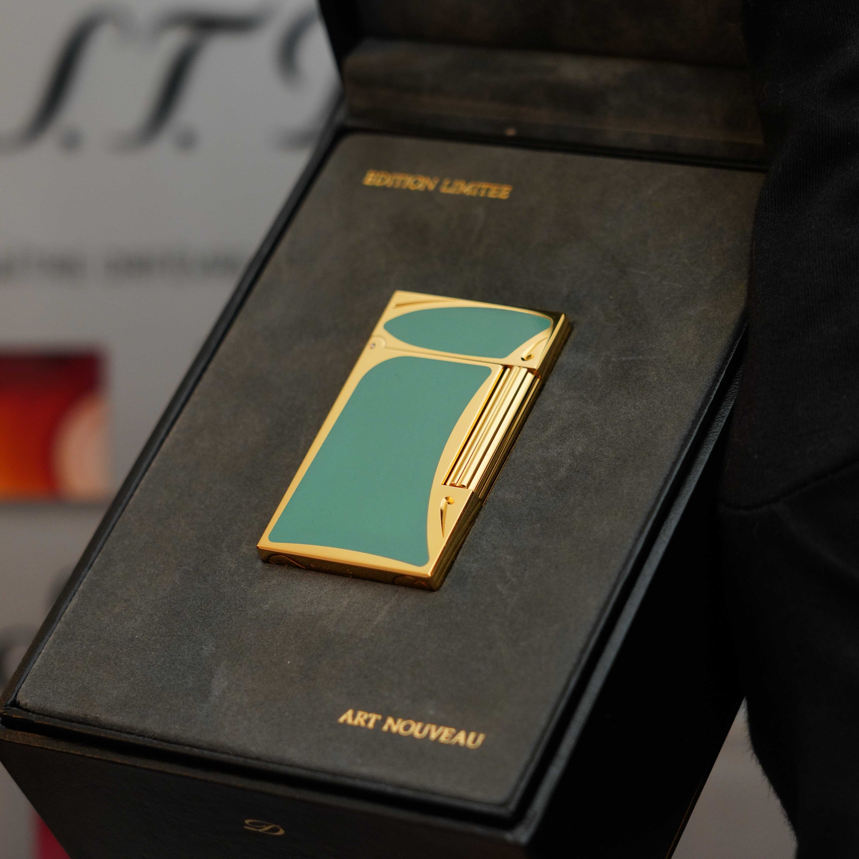 A **Vintage 1993 rare Art Nouveau early Limited Editions 24k Gold finish natural Green lacquer ligne 2 lighter** by **S.T. Dupont**, labeled "Edition Limitee" and "Art Nouveau," is displayed in a black box.