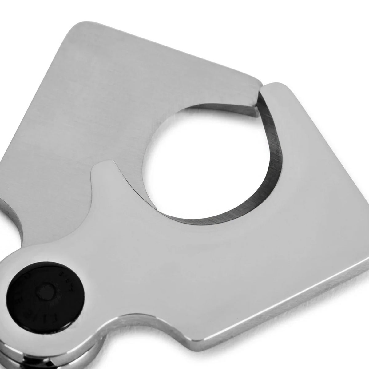 A close up of a stainless steel cigar cutter with a black textured button, shown on a clean white background.