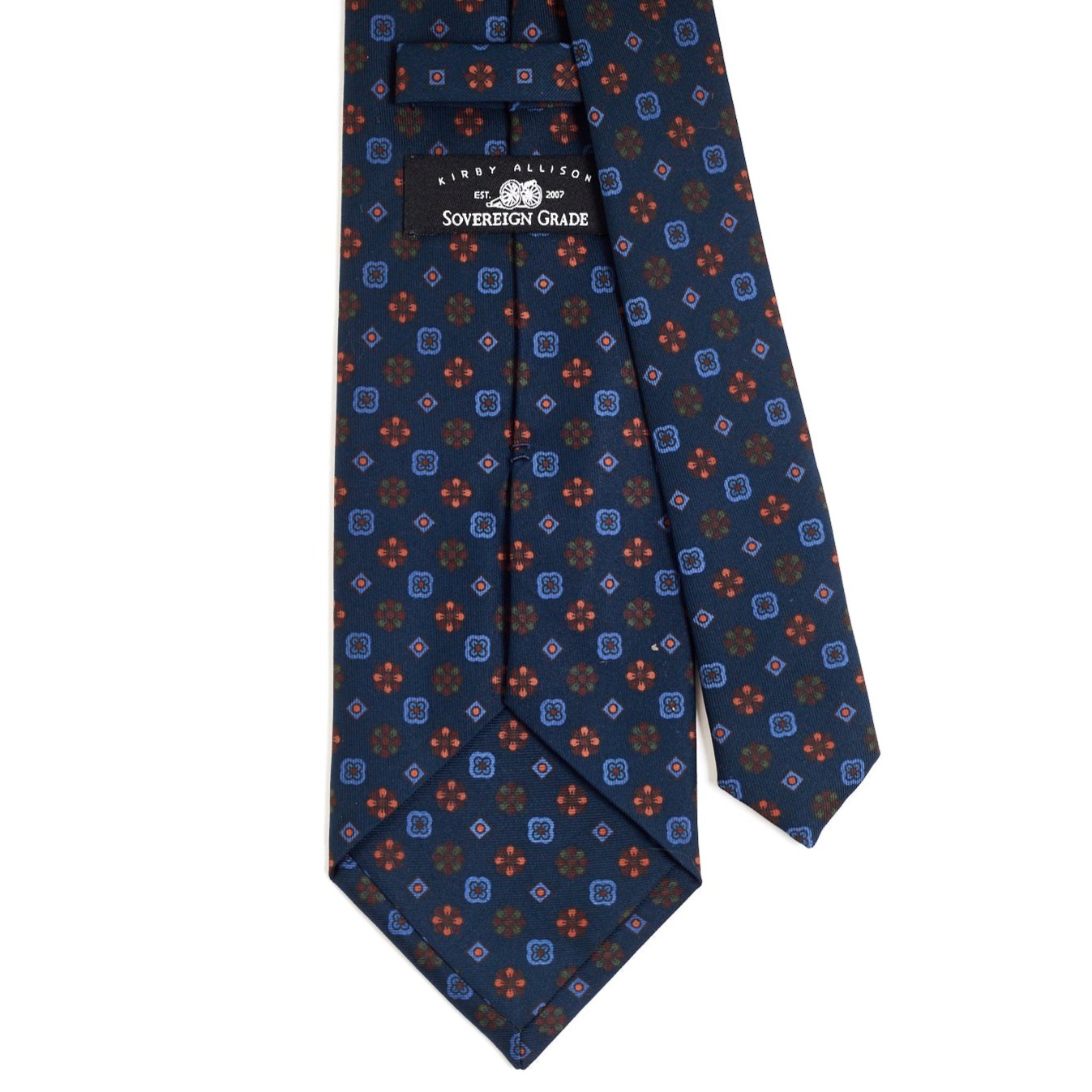 A Sovereign Grade Dark Navy Mixed Floret Ancient Madder Tie from KirbyAllison.com, with a blue and orange pattern of highest quality.