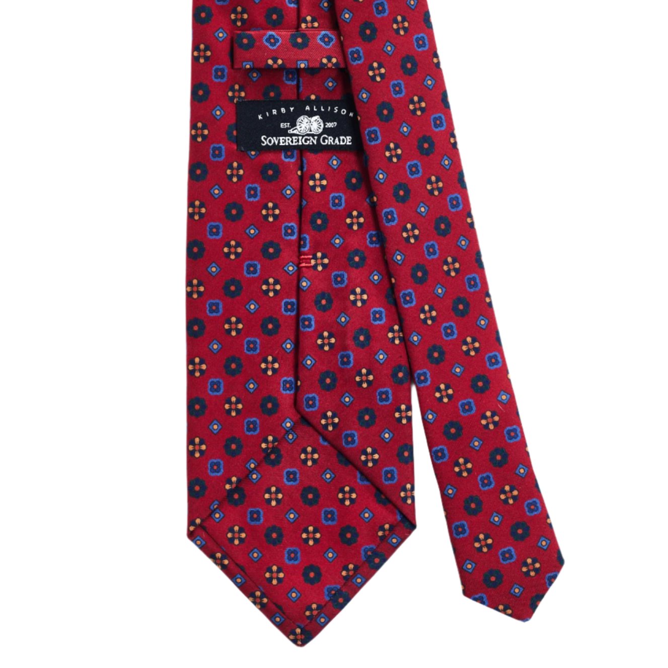 A high-quality Sovereign Grade Red Mixed Floret Ancient Madder Tie with a blue and red pattern by KirbyAllison.com.