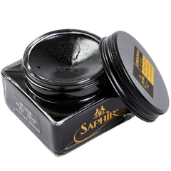 A jar of Saphir Cordovan Cream Shoe Polish from KirbyAllison.com sitting on a white surface.