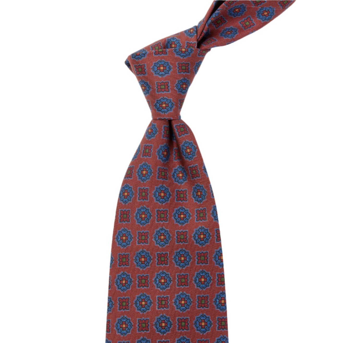 A handmade Sovereign Grade Rust Floral Diamond Ancient Madder tie with blue and red designs from KirbyAllison.com ties.