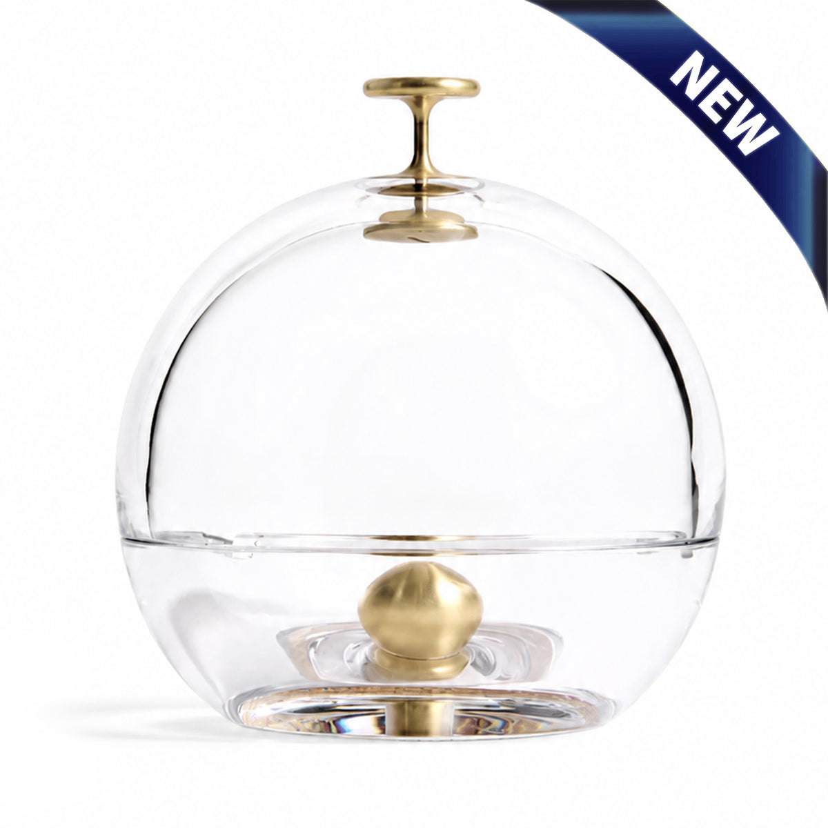 Clear crystal dome ashtray with brass knob finial and base, featuring a removable top.