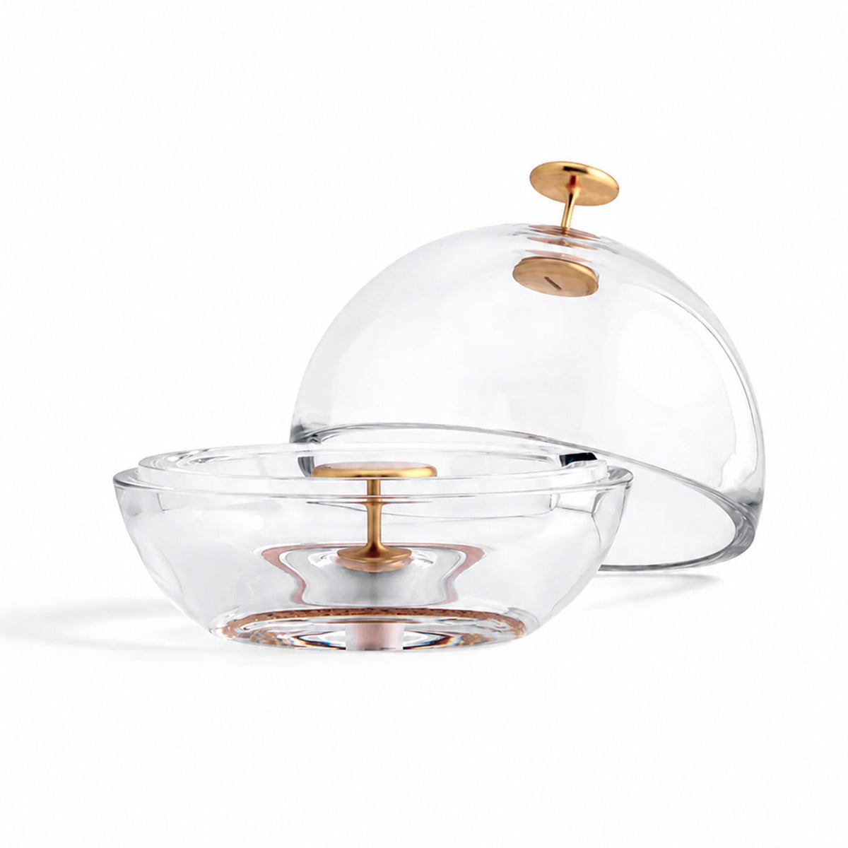 Clear glass dome-shaped ashtray with a matching lid and metallic gold handles, shown on a white background.
