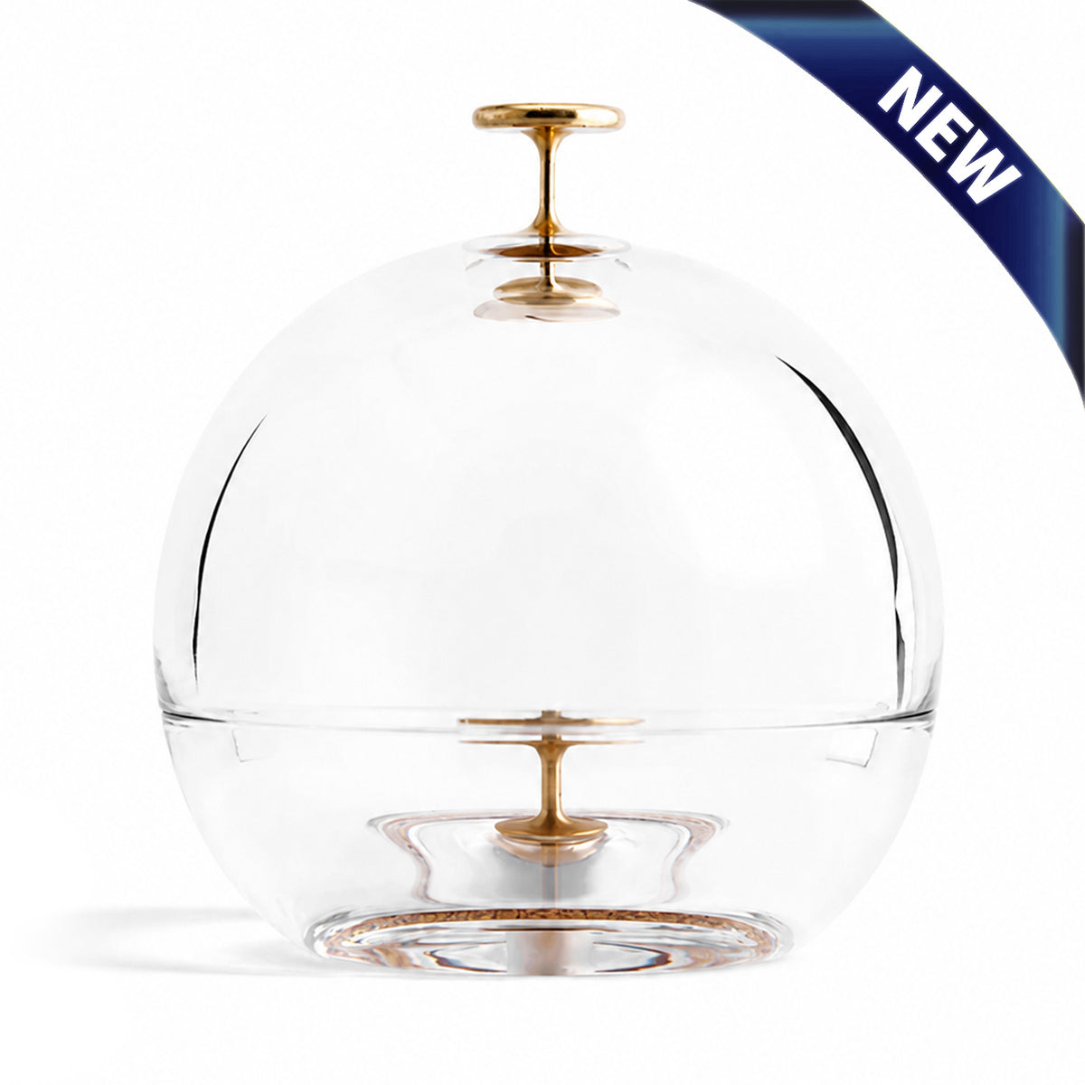 Clear crystal dome ashtray with brass finial and removable base for cigar resting.