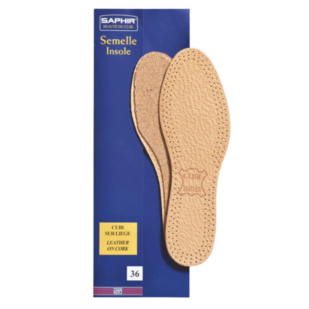 Pair of cork insoles with a Saphir branded box on a white background