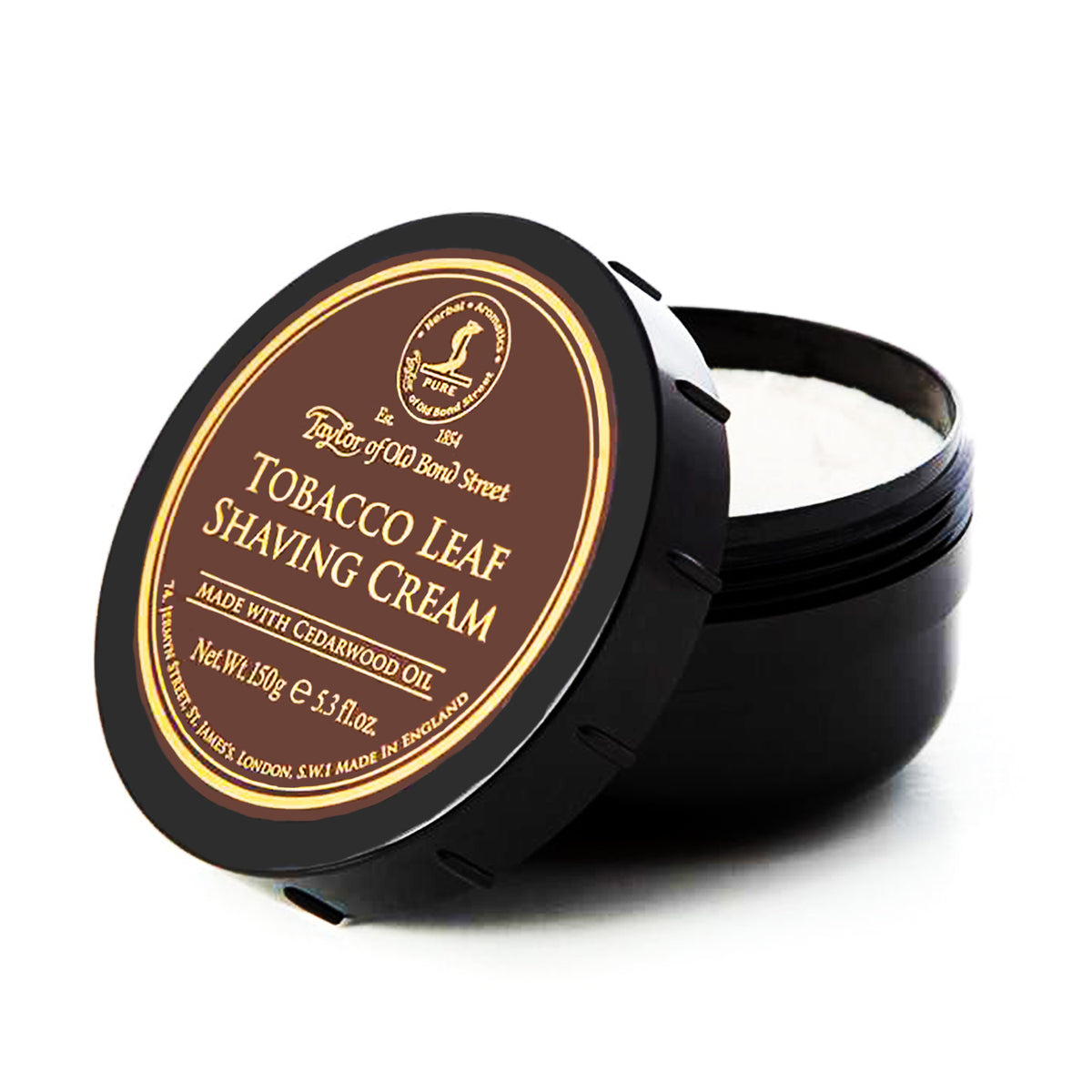Black ceramic bowl with brown and gold label reading "Taylor of Old Bond Street Tobacco Leaf Shaving Cream," containing white