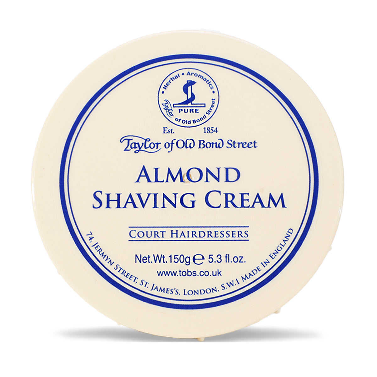 Cream-colored bowl with blue circular label reading "Taylor of Old Bond Street Almond Shaving Cream," 150g.