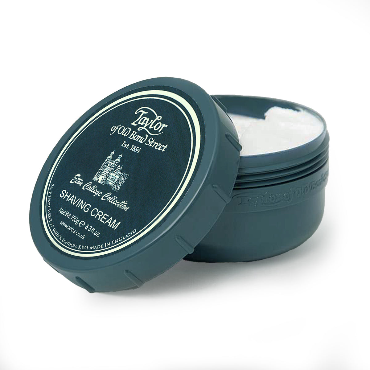 Dark blue ceramic bowl with white cream inside and labeled lid reading Taylor of Old Bond Street Eton College Shaving Cream.