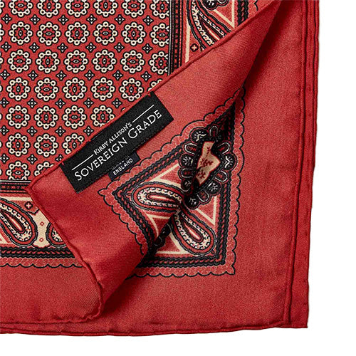 The Sovereign Grade 100% Silk Crimson Pocket Square from KirbyAllison.com, featuring luxurious silk in a striking crimson shade, is designed to enhance any ensemble with a sophisticated flair.