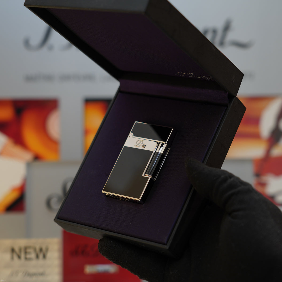 S.T. Dupont Ligne 2 lighter in black lacquer with platinum trim, displayed in open black presentation box.