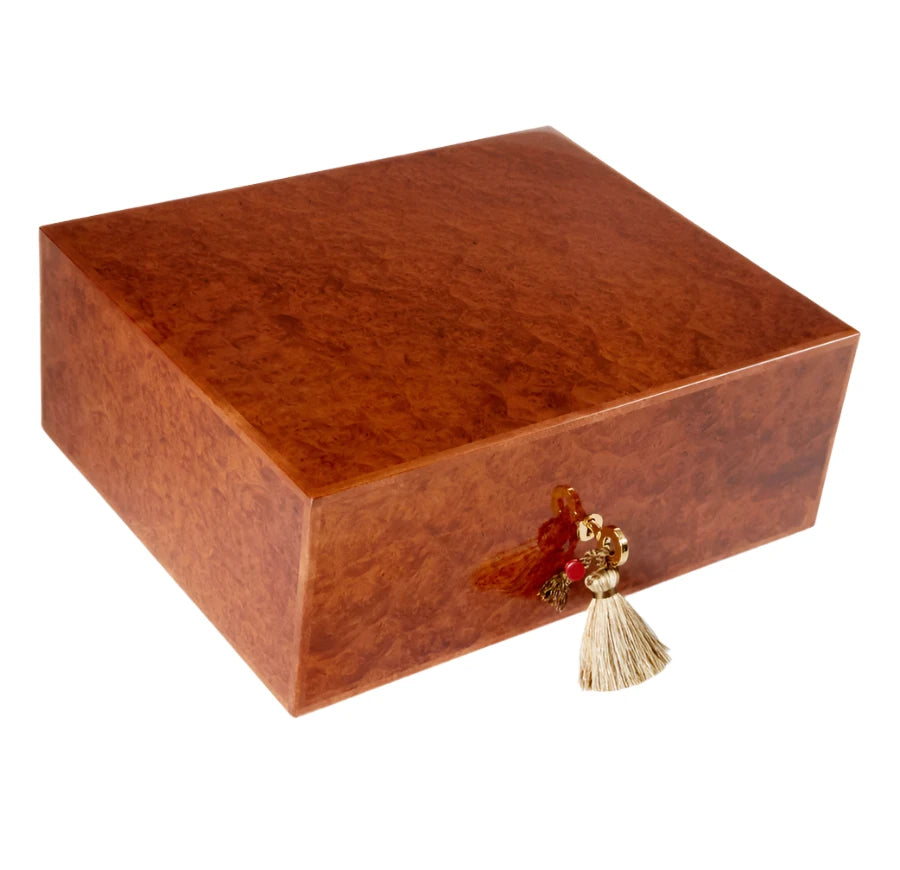 An Elie Bleu Amboyna Burl "Classic" Humidor - 75 Cigars with a tassel on it.