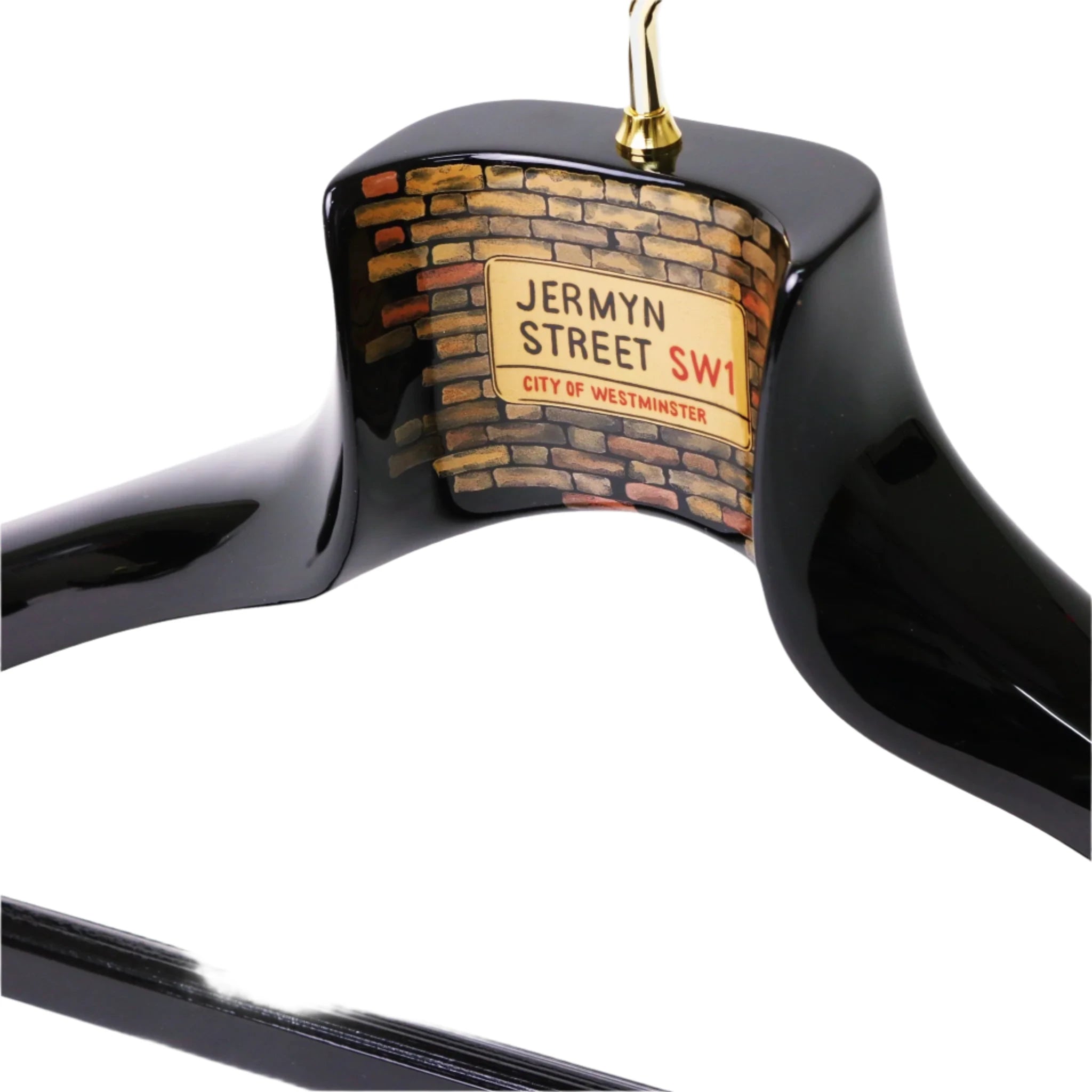 The Nakata Wajima Urushi Jermyn Street Limited Edition Hanger from KirbyAllison.com, inspired by the elegance of Jermyn Street, features a decorative detail with a street sign reading "Jermyn Street SW1, City of Westminster" against a brick wall background.