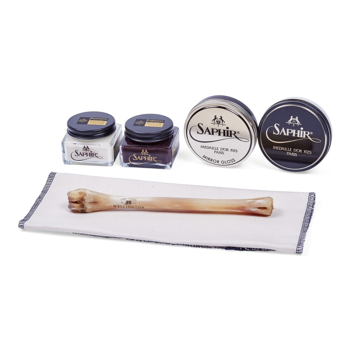 A Saphir Cordovan Starter Kit (6 Piece Bundle) including brushes, wax, and a polishing bone by KirbyAllison.com.