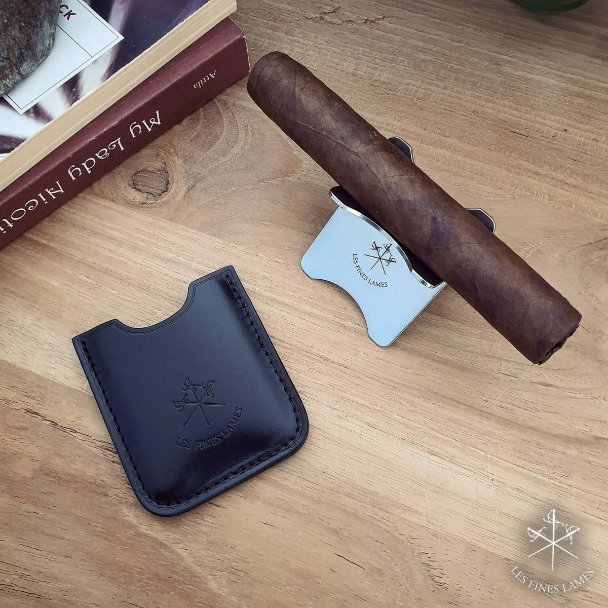 A Kirby Allison Black Cigar Stand showcasing a cigar on a calfskin leather stand from KirbyAllison.com.