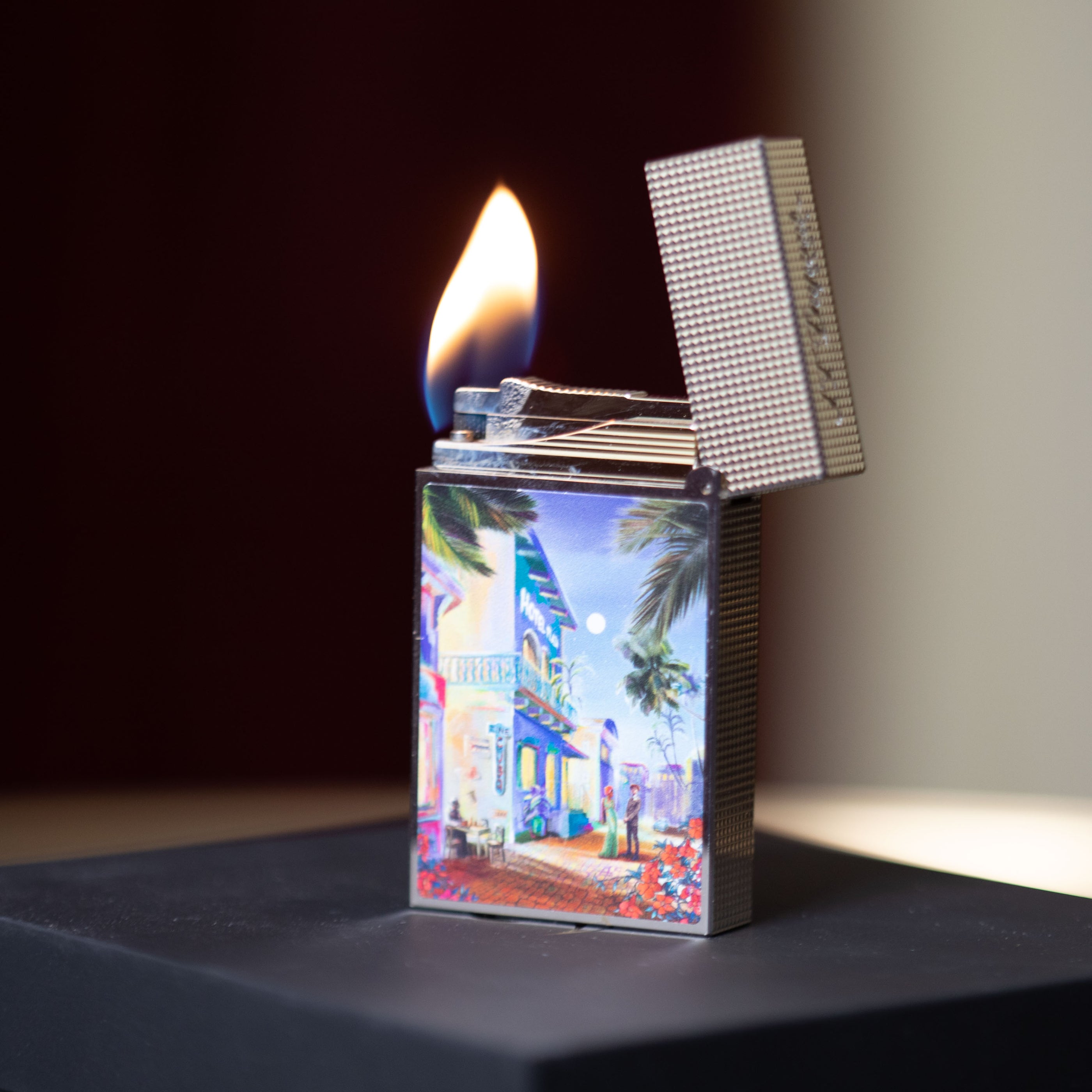 An S.T. Dupont Line 2 Cuba Motif Lighter with a picture of a city in Cuba motif.